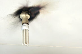 Electrical emergency. Electrical fire hazards with old light fitting