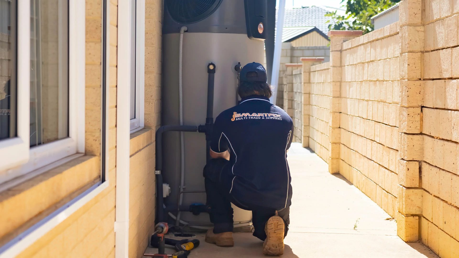 Plumber repairing a hot water system after a loss of hot water.