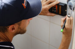 Smartfix plumber using advanced leak detection equipment to locate hidden water leaks in Perth property walls.