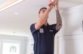 Electrician installing LED downlights in home