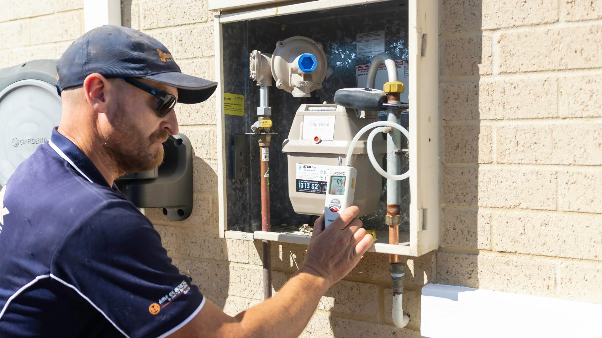 Gas plumber at outdoor gas meter