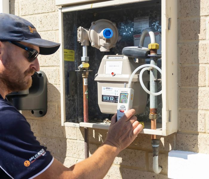 Gas plumber at outdoor gas meter