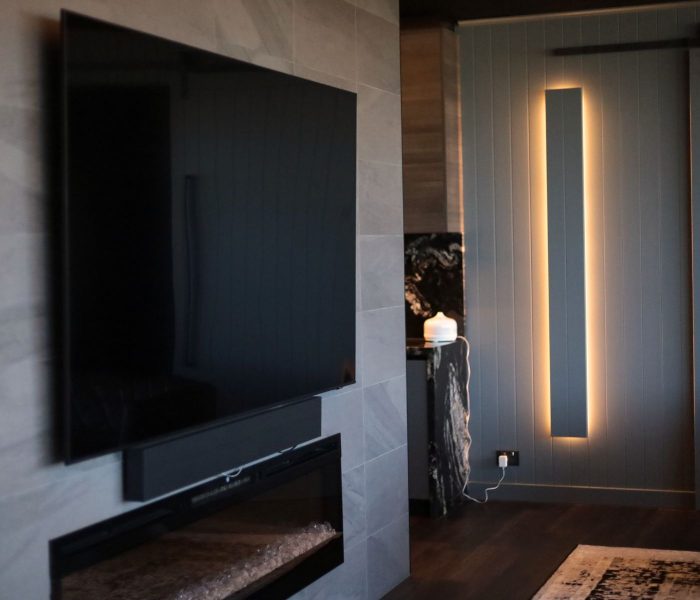 home theatre designs. TV wall mount with sound bar