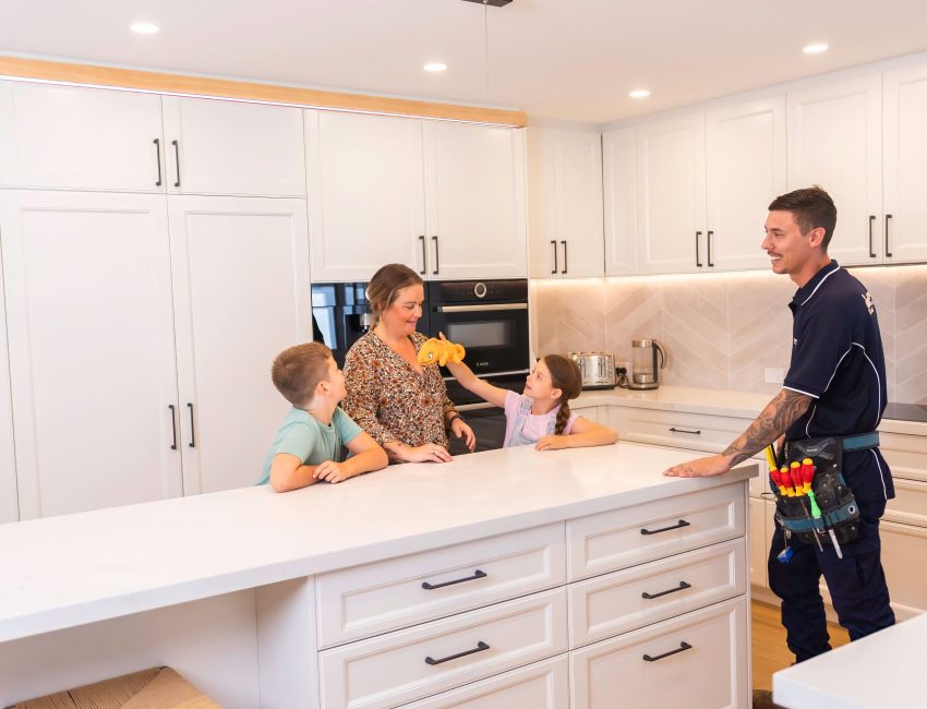 Happy customer in new modern kitchen