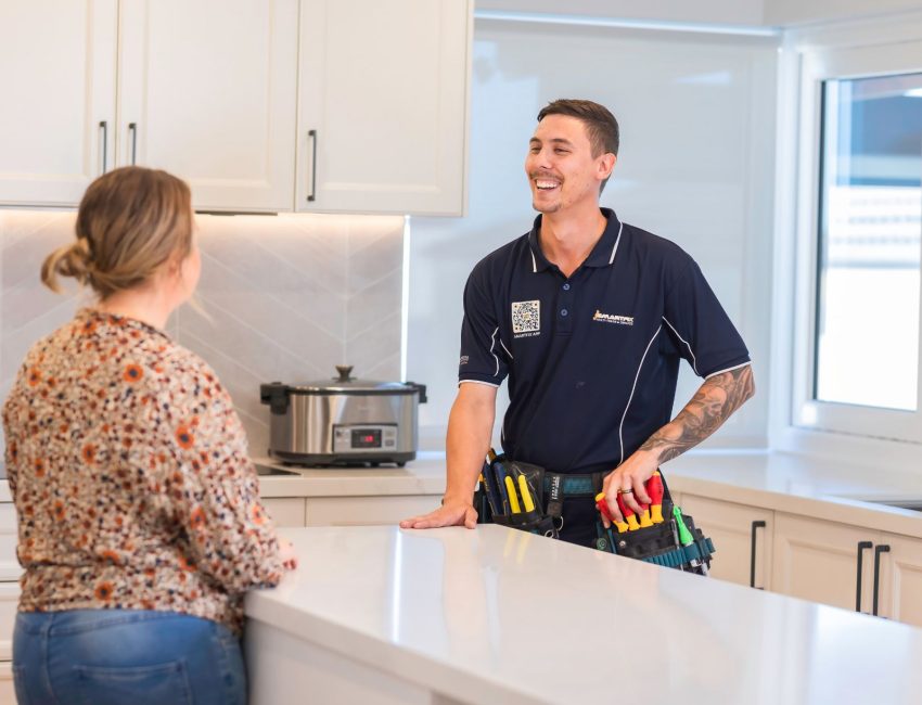 tradesperson speaking with customer. helpful service.