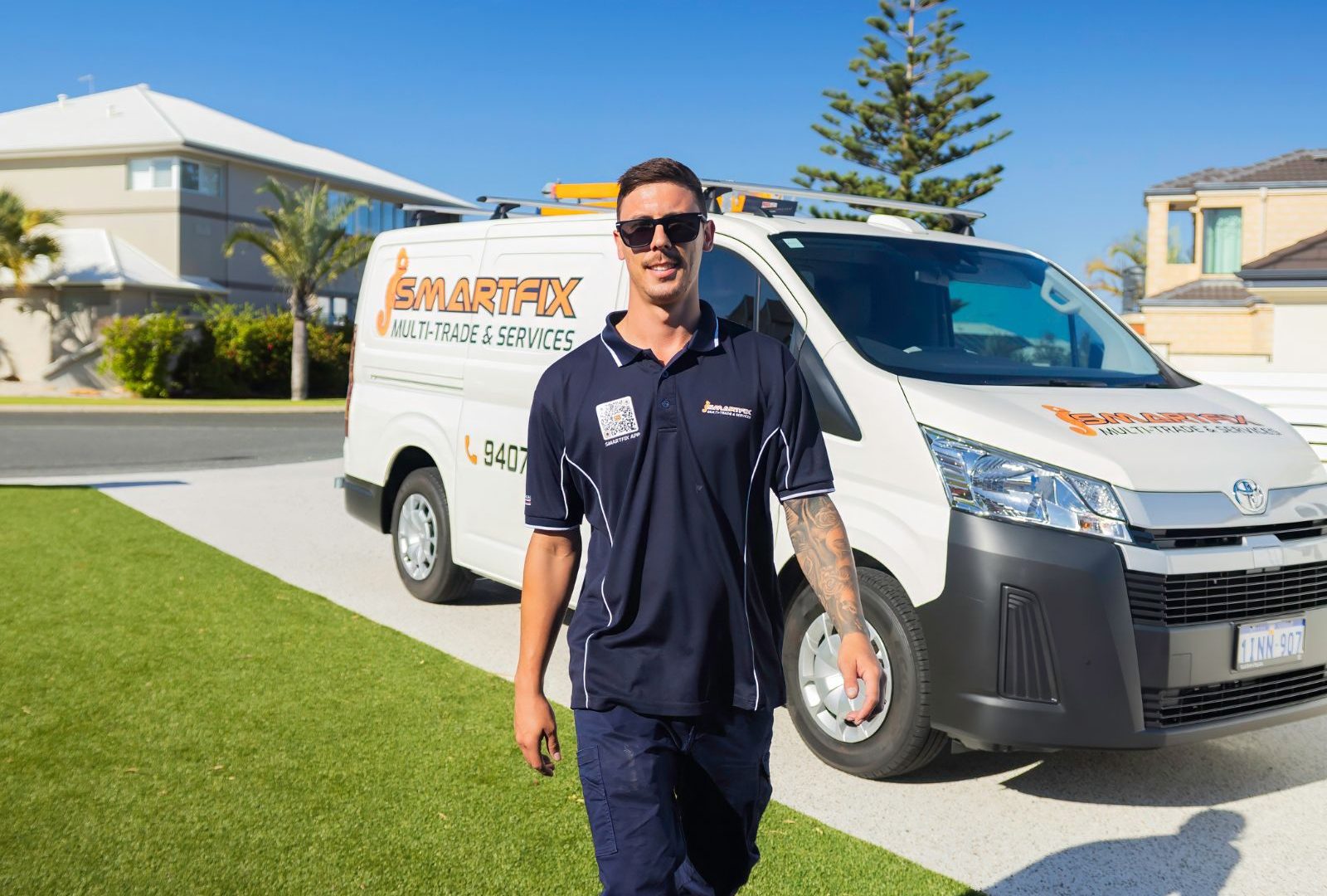 Perth tradesperson standing in front of van walking to customers house