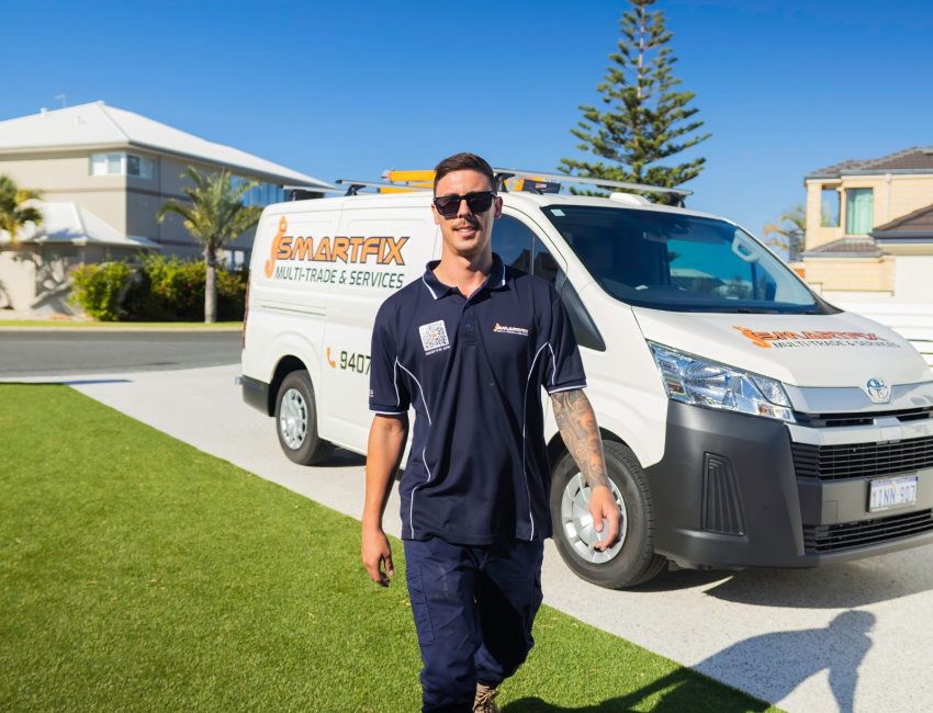 Perth tradesperson standing in front of van walking to customers house