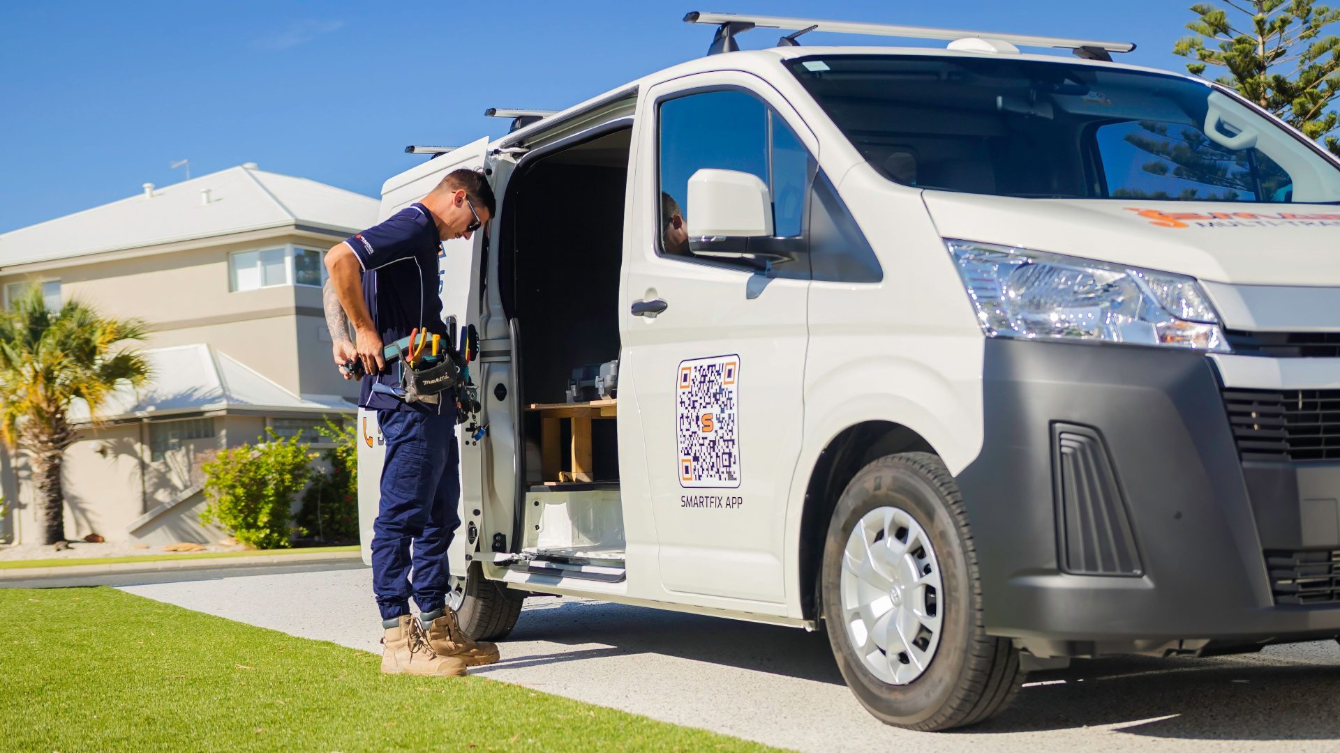 Smartfix electrician greeting a Perth homeowner at the door with a friendly smile and handshake before starting electrical work. Trusted, professional service you can count on.