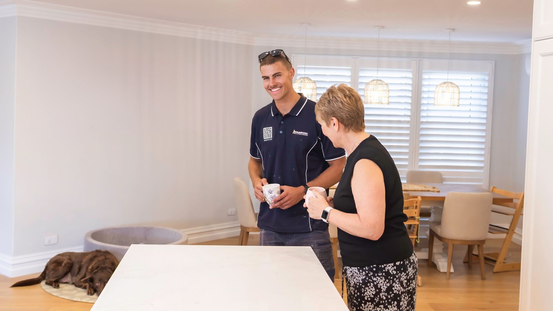 Smartfix painter with customer in newly painted home