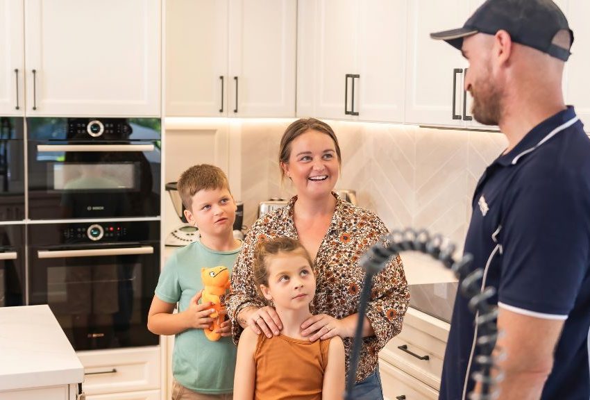 Smartfix plumbing finished installing kitchen tap and is now talking with customer