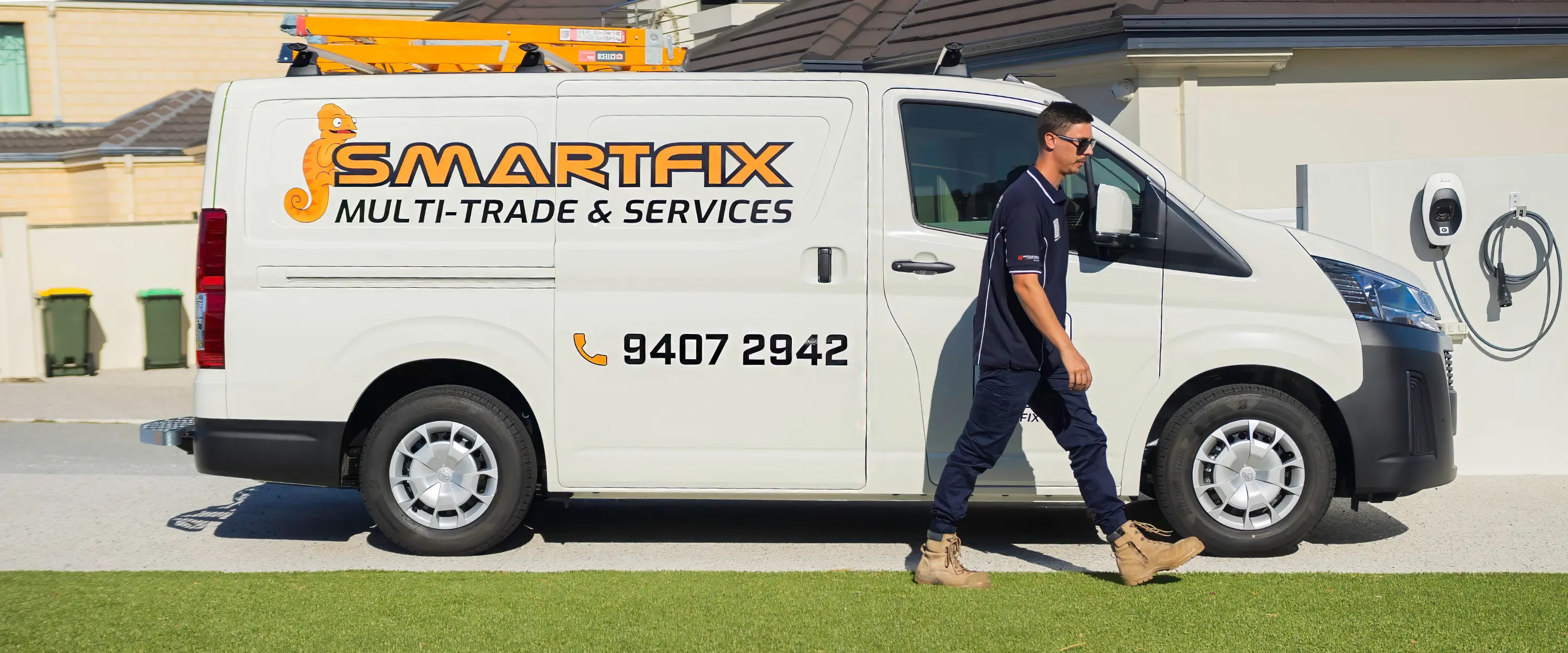 Smartfix tradie walking from van to a customer’s home, ready to begin work. On time, professional, and tidy in appearance.