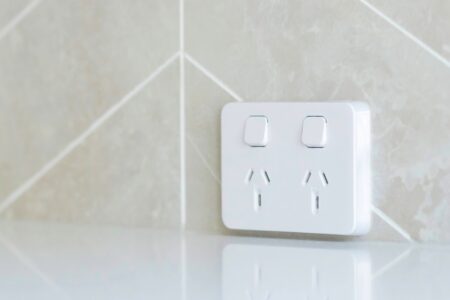 Clipsal powerpoint installed by Smartfix electricians on a tiled splashback