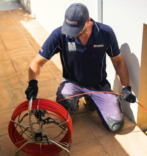 Smartfix plumbing clearing a blockage in outdoor drain